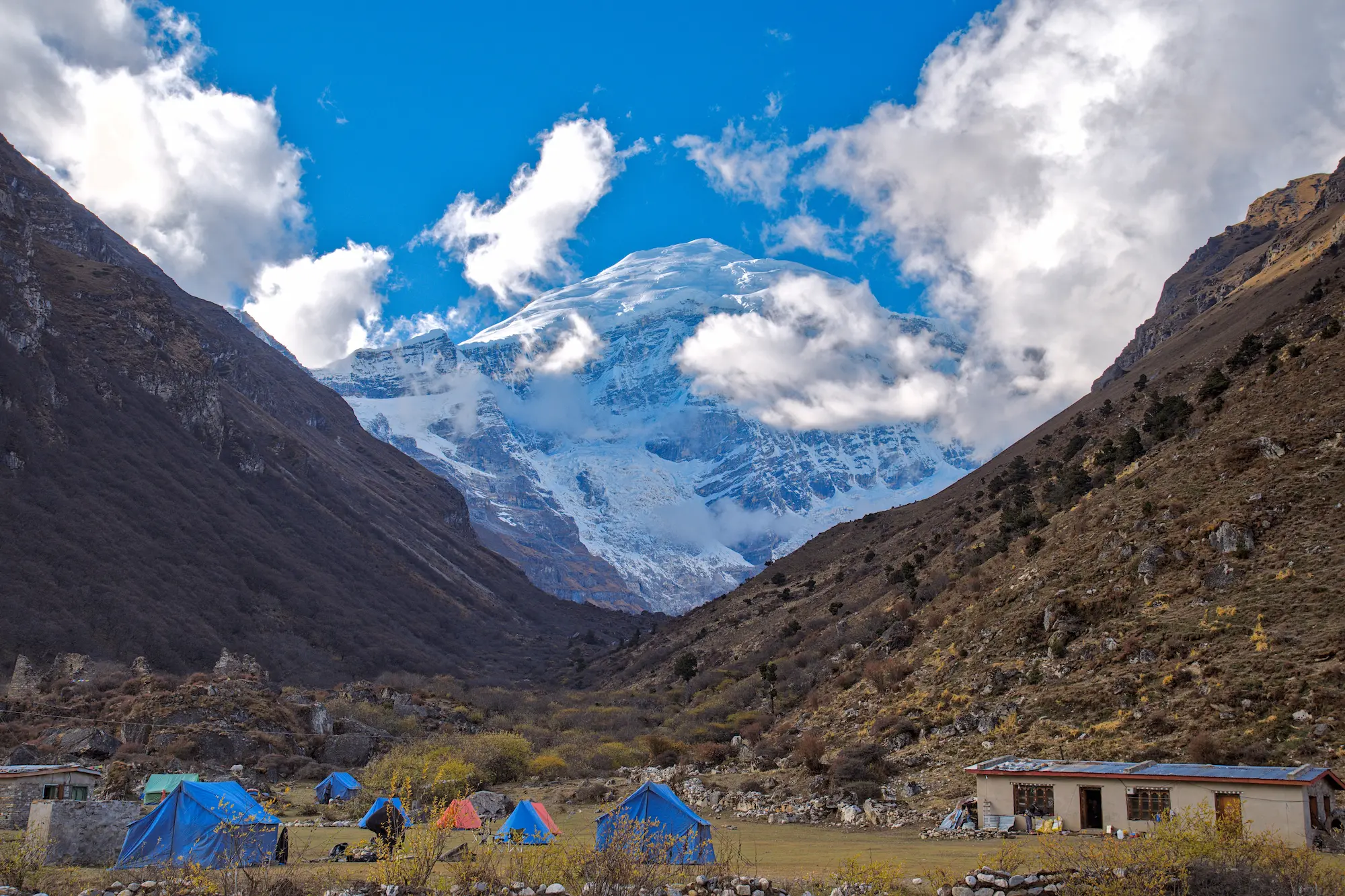 The sacred peak of Jomolhari rising above a trekking camp